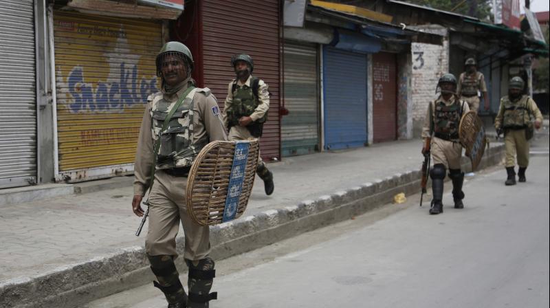 Paramilitary soldiers patrol during restrictions in Srinagar. (Photo: AP)