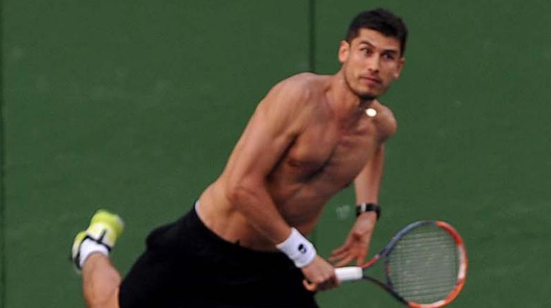 Farrukh Dustov practices his serve ahead of the Davis Cup tie against India. (Photo: DC)