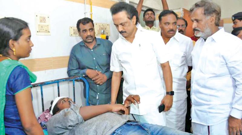 DMK working president M.K. Stalin meets a party cadre injured in an assault while trying to stop cash distribution (Photo: DC)