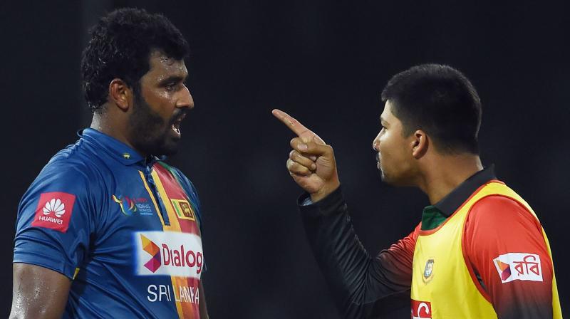 Drama unfolded when Mustafizur Rahman missed two bouncers from Isuru Udana in the final over and was run out but the Bangladesh players contested the call, saying it was a no ball due to its height. (Photo: AFP)