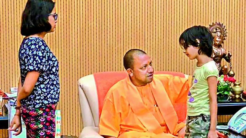UP CM Yogi Adityanath interacts with Tiwaris family. PTI the children of the private company executive Vivek Tiwari, who was allegedly shot at by a police constable, during a meeting with his family members in Lucknow, Monday, Oct 1, 2018. (PTI)