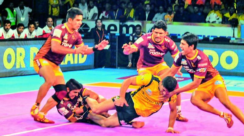 Action from the VIVO Pro Kabaddi League match between UP Yoddha and Telugu Titans at Gachibowli Indoor Stadium in Hyderabad on Tuesday. (Photo: P. Surendra)