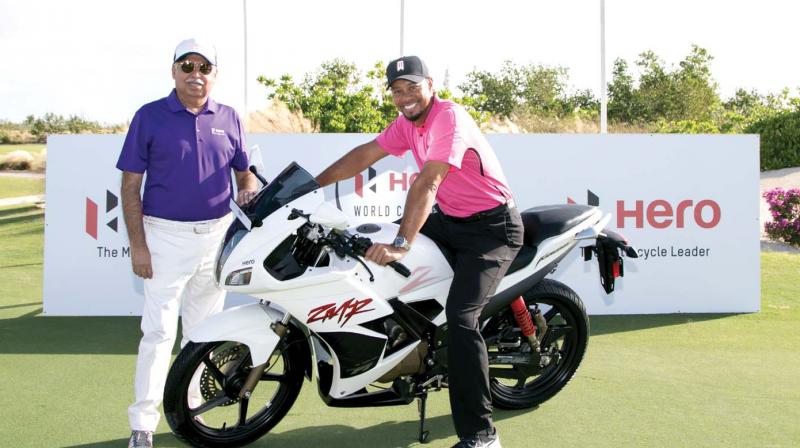 Tiger Woods and Pawan Munjal strike a moment at Albany, venue of the Hero World Challenge that tees off in The Bahamas on Thursday.
