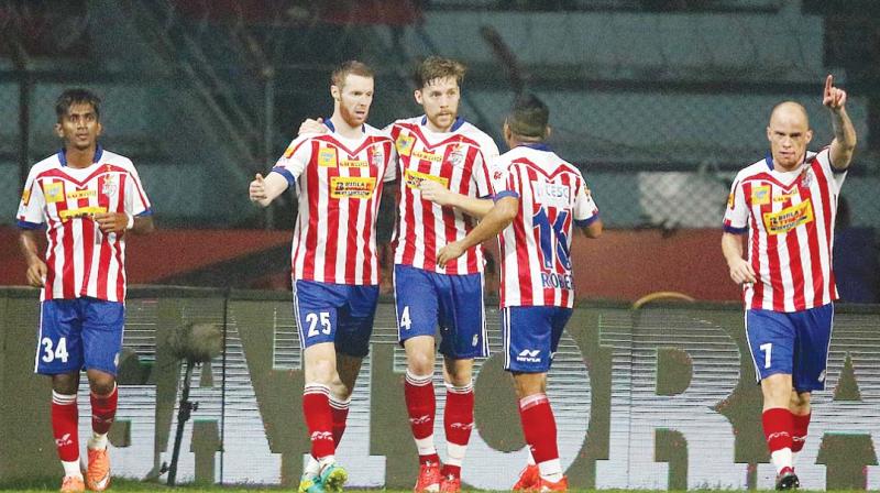 Atletico de Kolkata players celebrate after equalising against Kerala Blasters on Tuesday. (Photo: AFP)