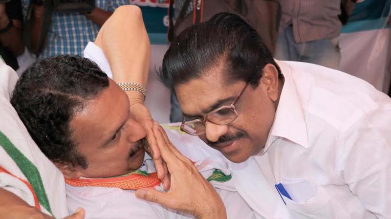 Congress MLA K. Muraleedharan who has been holding an indefinite fast before the Law Academy Law College in Thiruvananthapuram on Tuesday since Feb. 2 is confiding to KPCC president V.M. Sudheeran. (Photo: Mohammed Mazhar)