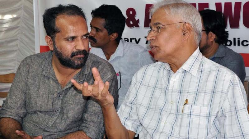 Former Doordarshan additional director general K. Kunhikrishnan with Calicut Press Club president Kamal Varadoor during a seminar on public broadcasting in Kozhikode on Tuesday. (Photo: VISWAJITH.K)