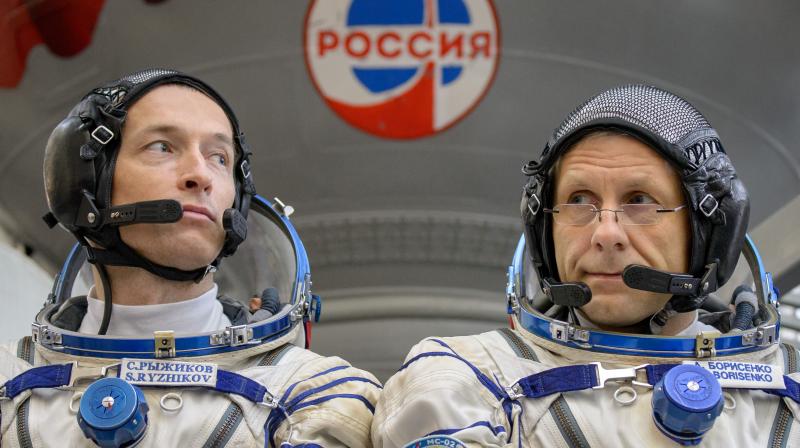 Expedition 49 Russian cosmonauts Sergei Ryzhikov, left, and Andrey Borisenko of Roscosmos
