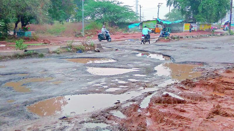 Newly-laid road in Lingampally damaged due to rain.