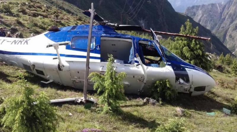A police officer said the helicopter got disbalanced while taking off due to insufficient air pressure and fell down. (Photo: ANI/Twitter)