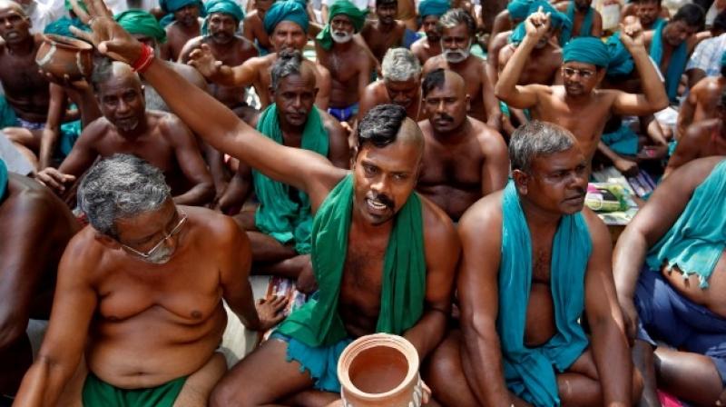 Farmers from Tamil Nadu pose half shaved during a protest demanding a drought-relief package from the Centre, in New Delhi, on April 3, 2017. (Photo: PTI)