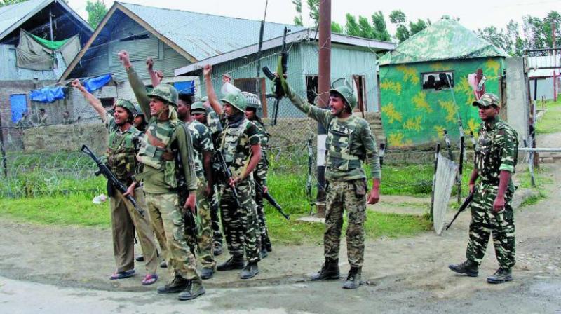 Security personnel celebrate after killing four suicide attackers who attacked a CRPF camp at Sumbal in Bandipora district of north Kashmir. (Photo: PTI)