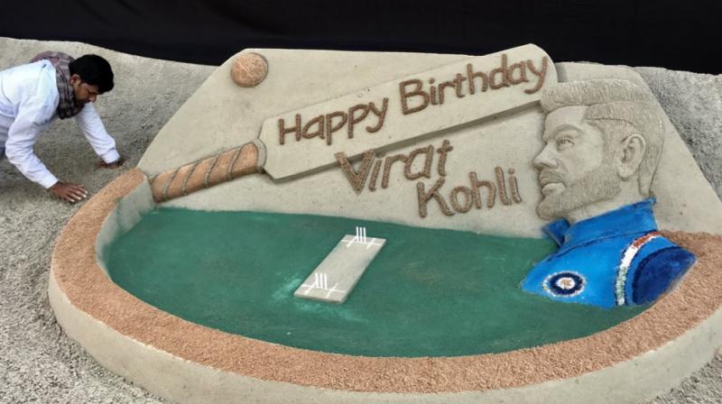 Noted sand artist Sudarsan Pattnaik Monday made a cricket-themed sand art installation here to wish ace batsman Virat Kohli on his 30th birthday. (Photo: Twitter / Sudarsan Pattnaik)