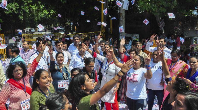 Students raise slogans as they campaign during Delhi University elections, in New Delhi, on Wednesday. (Photo: File)