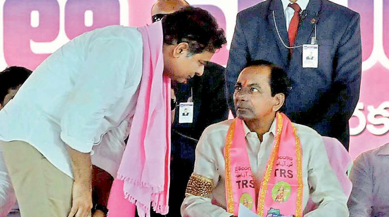 father, son and the centre stage: Telangana Rashtra Samiti president and Chief Minister K. Chandrasekhar Rao (right) along with his son K.T. Rama Rao during one of the election rallies. The TRS party was formed with the sole aim carving out a separate Telangana state. Now, Mr Chandrasekhar Rao has set his eyes on national politics.