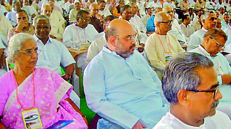 BJP president Amit Shah sitting almost anonymously in the audience at an RSS conclave in Lucknow. Mr Shahs deference for the ideological fountainhead underscores the importance of the swayamsevaks for the partys victory.