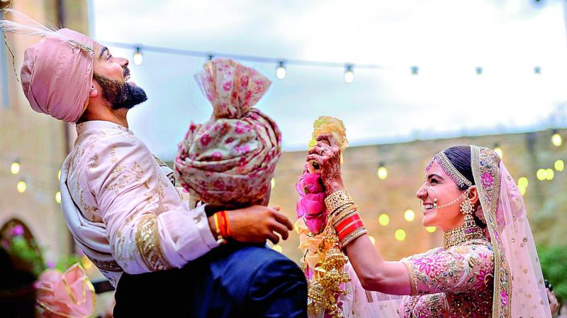 Cricket captain Virat Kohli with his actress wife Anushka Sharma exchange garlands during their wedding in Milan, Italy on Monday.
