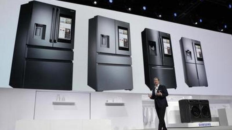 Whirlpool, Samsung and other manufacturers are unveiling new ways to use voice services to control laundry machines, refrigerators and other home systems. (Photo: AP)