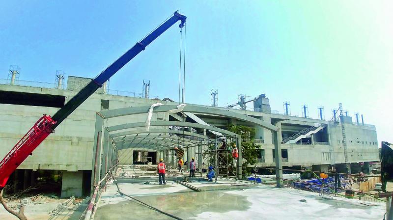 Work is on in full swing for the Mahatma Gandhi Bus Sation near the Metro station at Musi river in the city.  (Photo: DC)