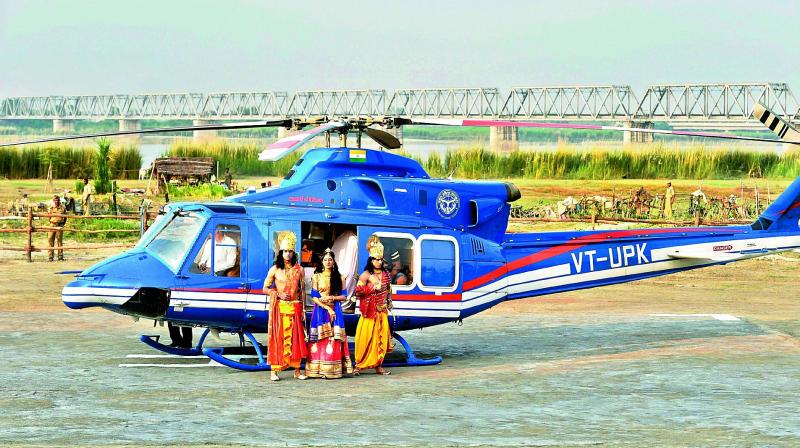 Artistes dressed up as Lord Rama, Sita and Lakshman arrive by a copter for Deepotsav celebrations in Ayodhya on Wednesday. (Photo: PTI)