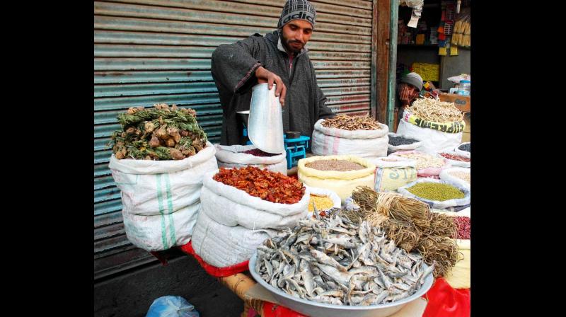 A vendor selling dried vegetables, fish and herbs which form an integral part of the Kashmiri cuisine, especially during the extreme winter. (Photo: Rising Kashmir)