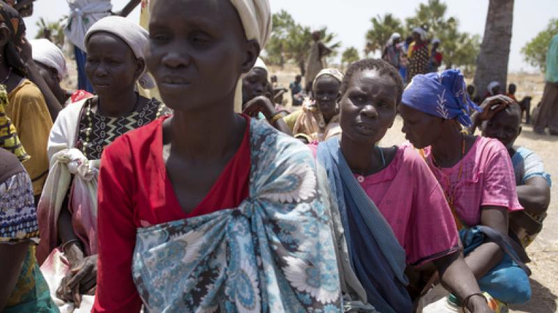 South Sudanese women wait for food distribution by the World Food Programme. (Photo: AP)