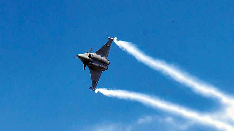 A Rafale fighter aircraft performs a manoeuvre during a rehearsal at the Yelahanka Air Force Station in Bengaluru on Monday, ahead of Indias 12th Air Show. (Photo: AFP)