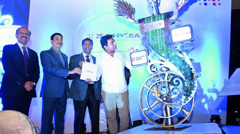 IT minister K.T. Rama Rao unveils a statue to mark the silver jubilee celebrations of Hysea in the city on Wednes-day as (from left) Cyient chairman B.V.R. Mohan Reddy and IT secretary Jayesh Rajan and HYSEA president Ranga Pothula look on. (Photo: DC)