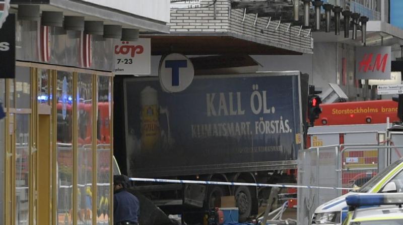 A truck ploughed into a crowd on a shopping street and crashed into a department store in central Stockholm on Friday
