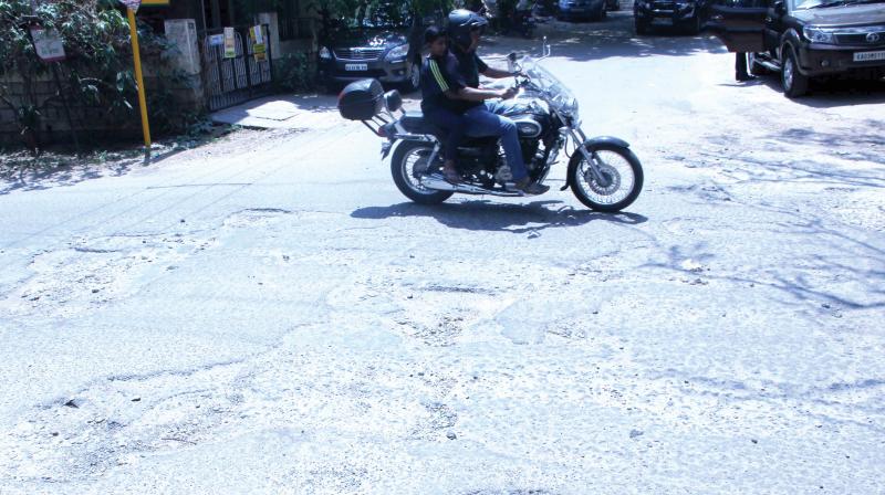 The  pothole-ridden 8th cross road, between 12th and 13th Mains, in Indiranagar. (Photo:DC)