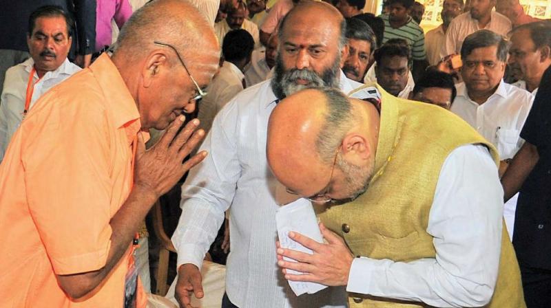 BJP chief Amit Shah calls on Sidharoodha Math seer in Hubballi on Thursday.  (Photo:KPN)