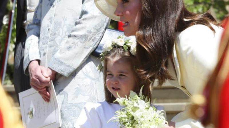 Britains Princess Charlotte and Kate, Duchess of Cambridge leave after the wedding of Prince Harry and Meghan Markle at St. Georges Chapel. (Photo: AP)