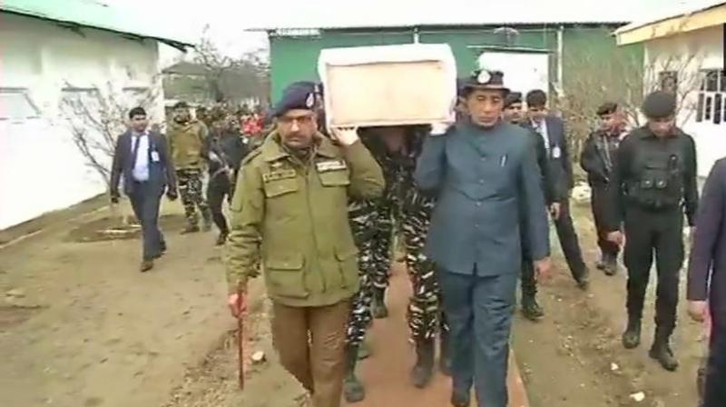 Union Ministers Rajnath Singh and J&K DGP Dilbagh Singh lend a shoulder to mortal remains of a CRPF soldier. (Photo: ANI | Twitter)