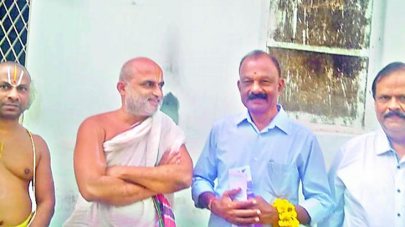 Andhra Pradesh Congress chief Raghuveera Reddy visits Chilkur Balaji Temple on Tuesday.