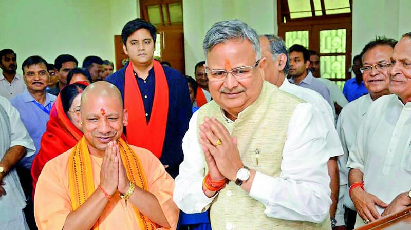 Chhattisgarh Chief Minister Raman Singh with his Uttar Pradesh counterpart Yogi Adityanath while filing his nomination papers in Chhattisgarh on Tuesday.