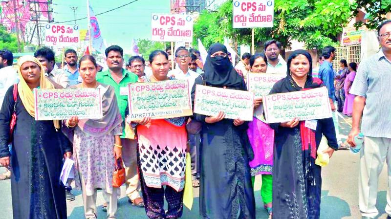 Employees, teachers, workers, pensioners JAC and  AP NGOs take part in  a protest rally demanding withdrawal of CPS and regularisation of contract employees in Guntur city on Tuesday. (Photo: DC)