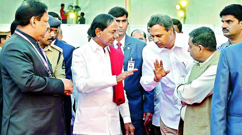 Chief Minister K. Chandrashekar Rao interacts with guests at the start of the World Telugu Conference in Hyderabad on Friday. 	(Photo: DC)