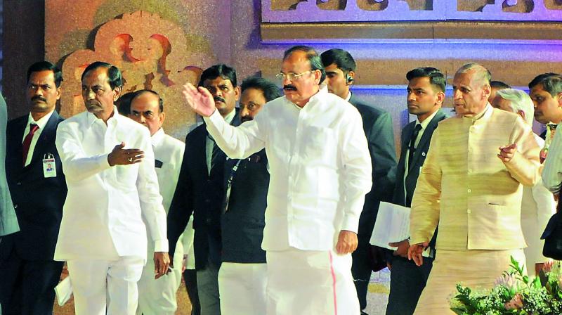 Vice-President M. Venkaiah Naidu, Governor E.S.L. Narasimhan and Chief Minister K. Chandrasekhar Rao at the World Telugu Conference in Hyderabad on Friday. (Photo: DC)