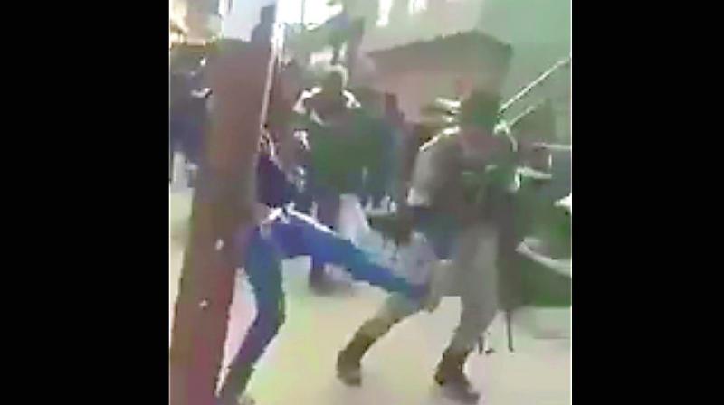 Screen grabs of a Kashmiri kicking a CRPF jawan