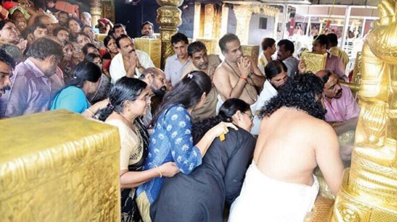 The photograph circulating in social media of women in the prohibited age group in the sanctum sanctorum of the Sabarimala Ayyappa temple recently.