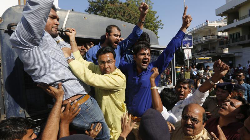 Congress activists shout slogans after being detained during a protest against the governments decision to withdraw high denomination notes from circulation, in Ahmadabad. (Photo: AP)