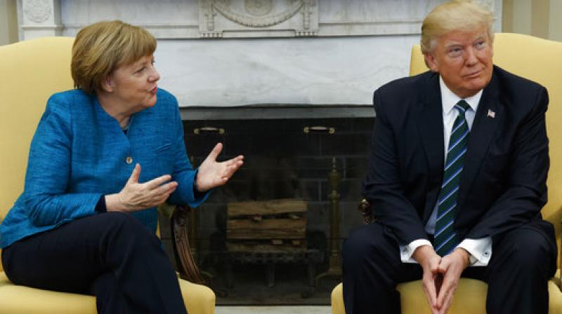 President Donald Trump meets with German Chancellor Angela Merkel in the Oval Office of the White House in Washington. (Photo: AP)
