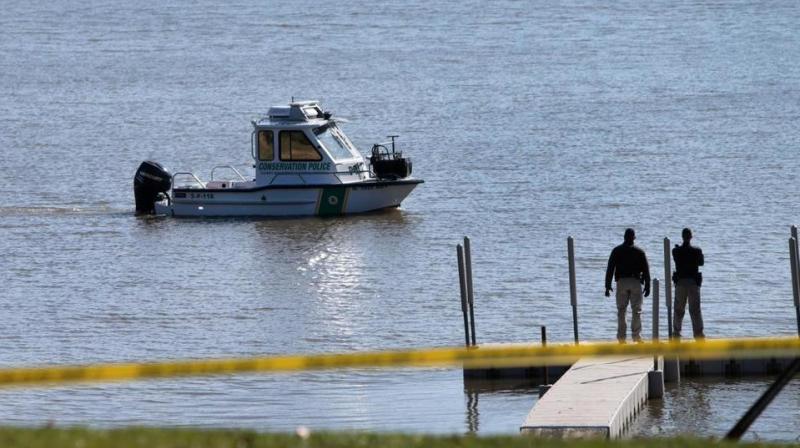 Conservation police search Silver Lake in Highland, Ill., on Thursday, March 16, 2017, after a car with an infant was pulled from the lake earlier in the morning. (Photo: AP)