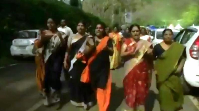 Slogans were raised as women marched in protest at Nilakkal, the main gateway to Sabarimala. (Screengrab | ANI)