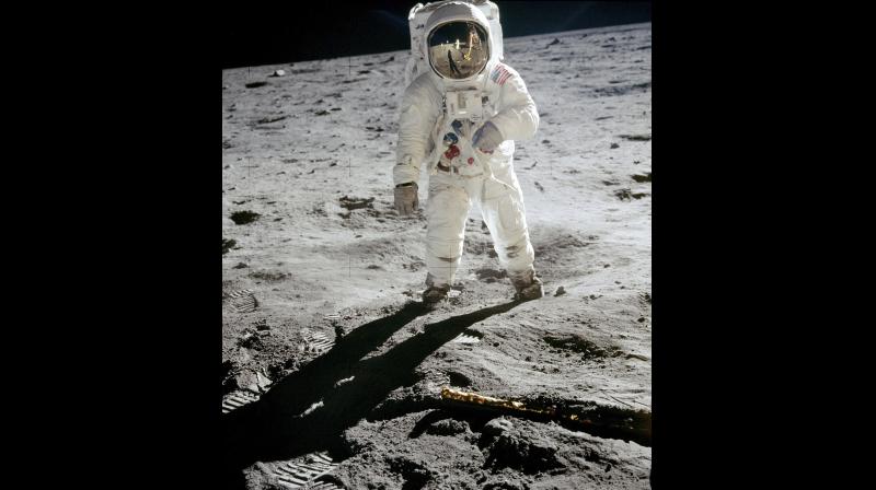 In this 1969 photo released by NASA, astronaut Buzz Aldrin walks on the surface of the moon near the leg of the lunar module Eagle during the Apollo 11 mission. Astronaut Neil Armstrong, who took the photograph, is reflected in Aldrins visor. (Photo: AP)