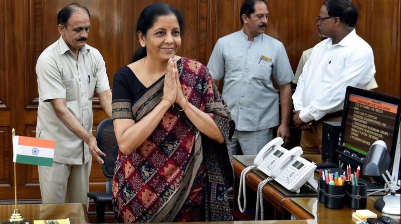 Defence Minister Nirmala Sitharaman takes charge at her office in New Delhi on Thursday, becoming the first full-time woman Defence Minister of the country. (Photo: PTI)
