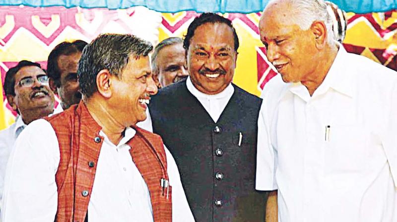 A file photo of RSS leader Dattatreya Hosabale with BJP leaders K.S. Eshwarappa and B.S. Yeddyurappa