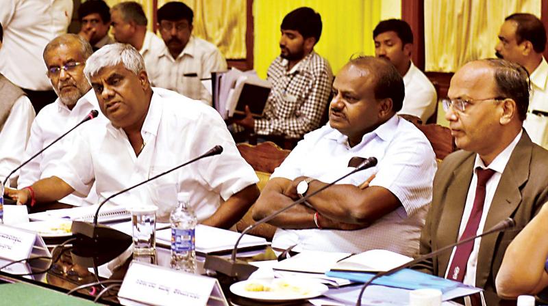 Chief Minister H.D. Kumaraswamy and PWD minister H.D. Revanna during a review meeting on NH development at Vidhana Soudha on Friday 	(Image: KPN)