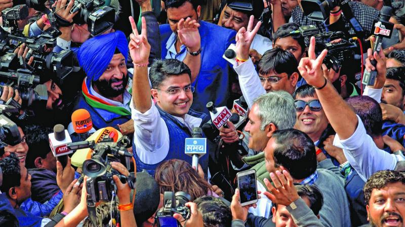 Congress leaders Sachin Pilot (above) waves at the crowd while going to attend the Congress Legislature Party meeting at the party office in Jaipur on Wednesday. (Photo: PTI)