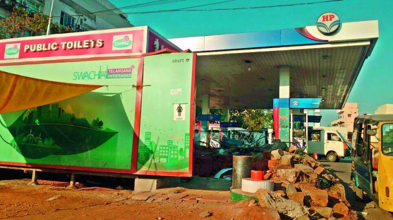 A toilet is built by the GHMC at a petrol bunk.