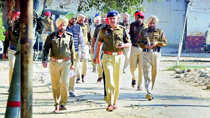 Police officials investigate after six inmates of Nabha Jail near Patiala escape on Sunday. (Photo: PTI)
